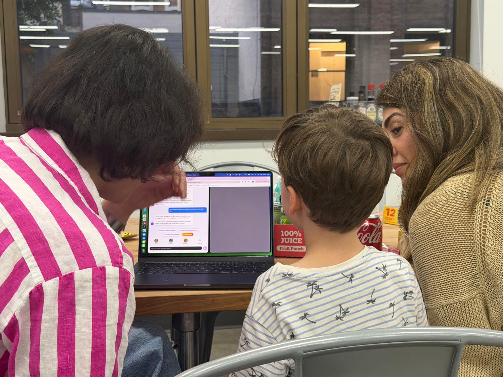 Family huddled around Plaio in a collaborative session